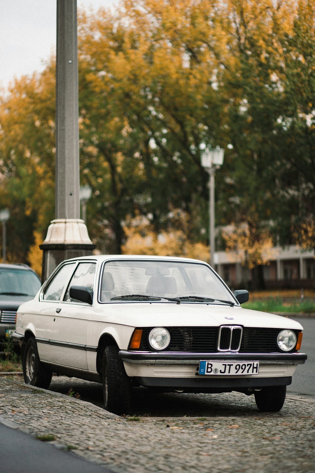 a white car parked on a street