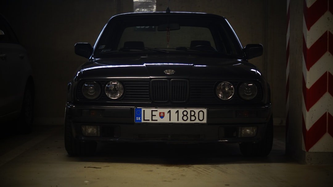 A car parked in a garage with a light on top of it