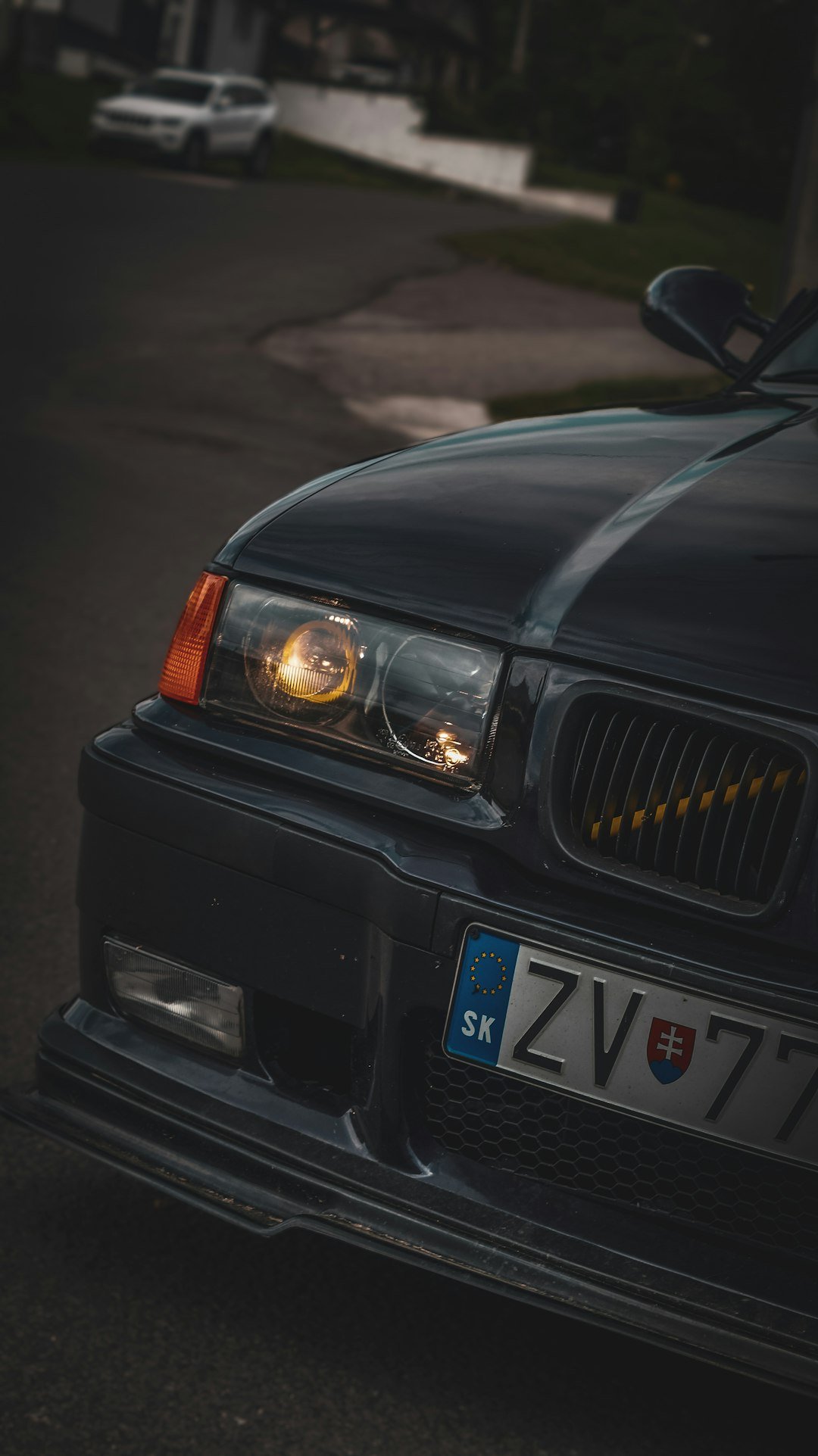 a black car parked on the side of the road