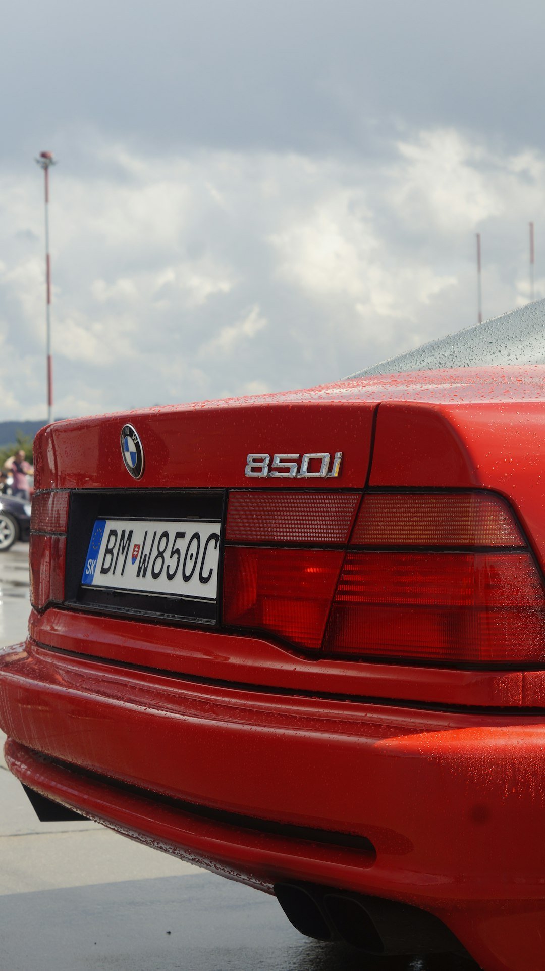 A red car parked in a parking lot