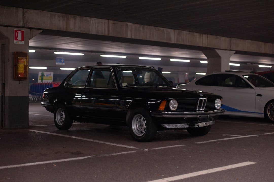 a couple of cars parked in a parking garage