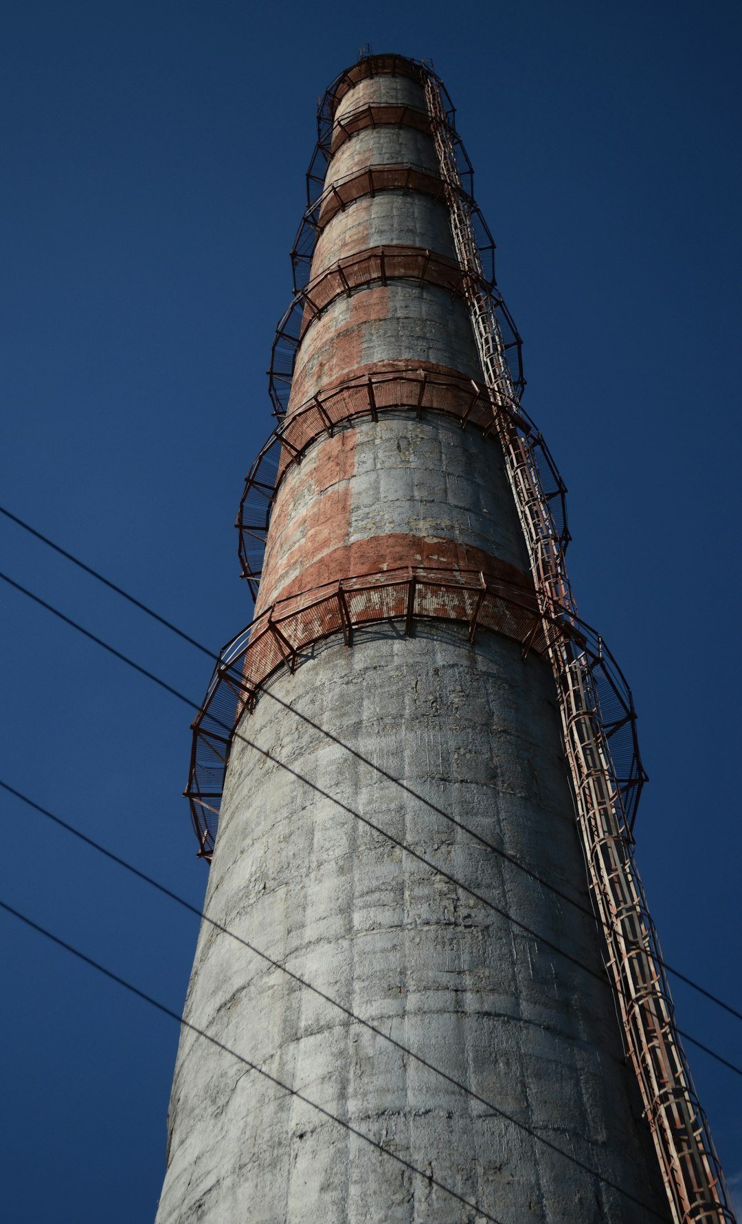 a tall tower with cables