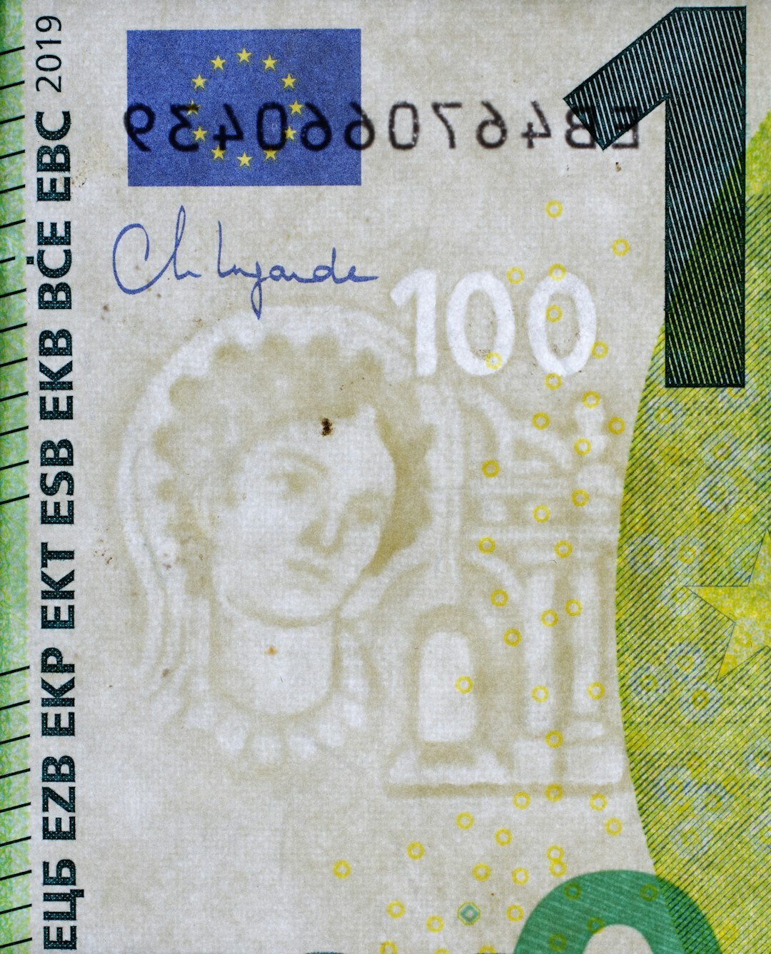 A paper money bill with the number one on it