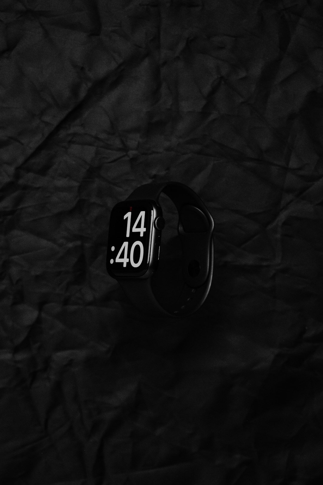 a close up of a watch on a black background