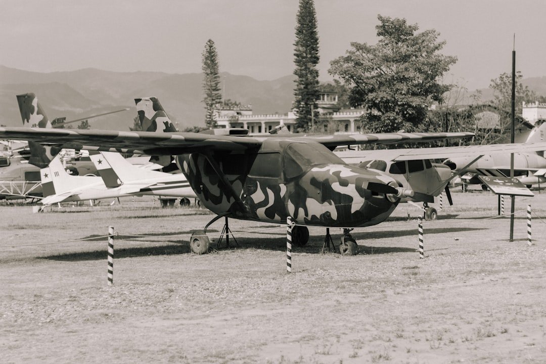 a black and white photo of a military plane