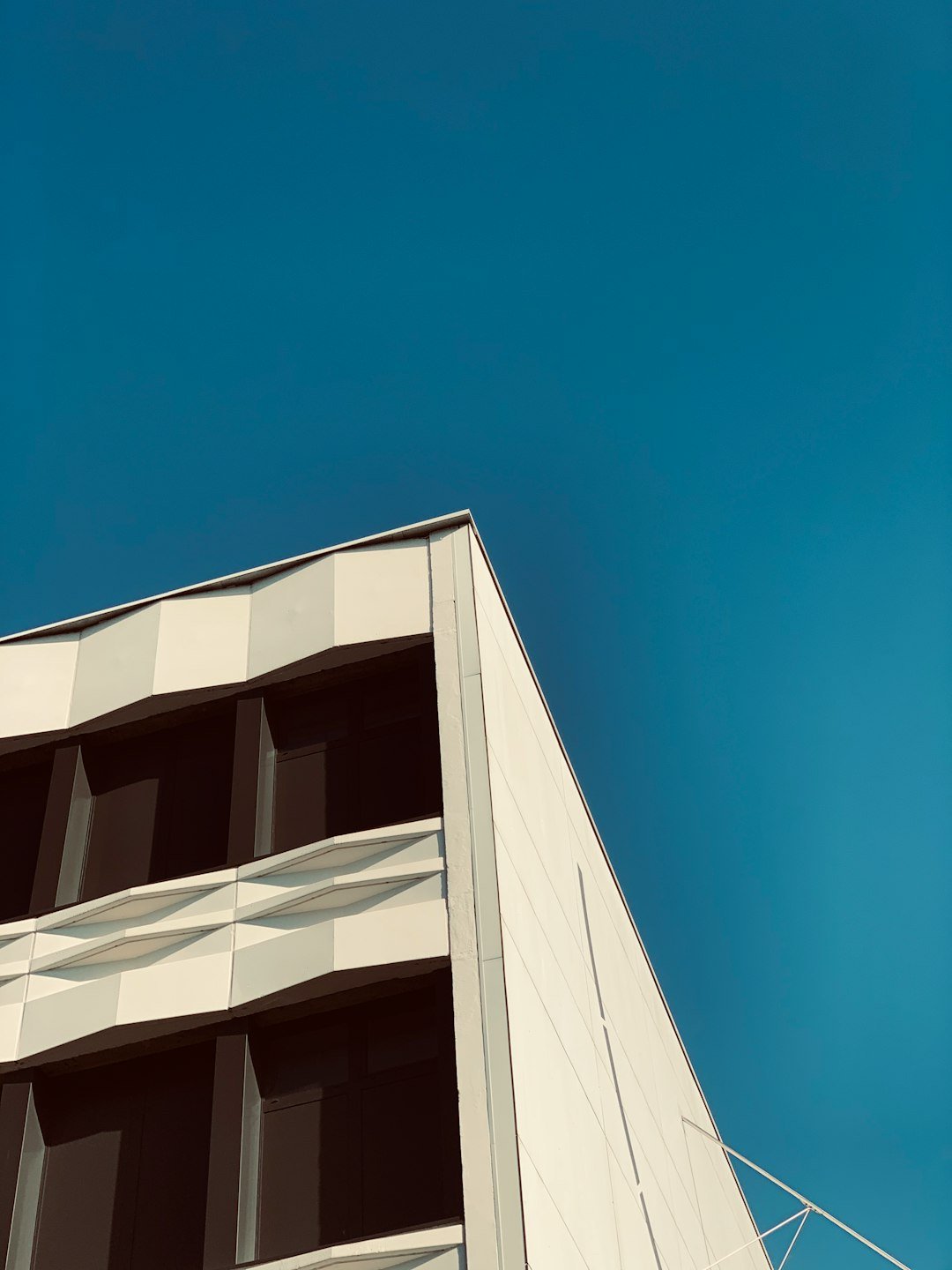 white concrete building under blue sky during daytime