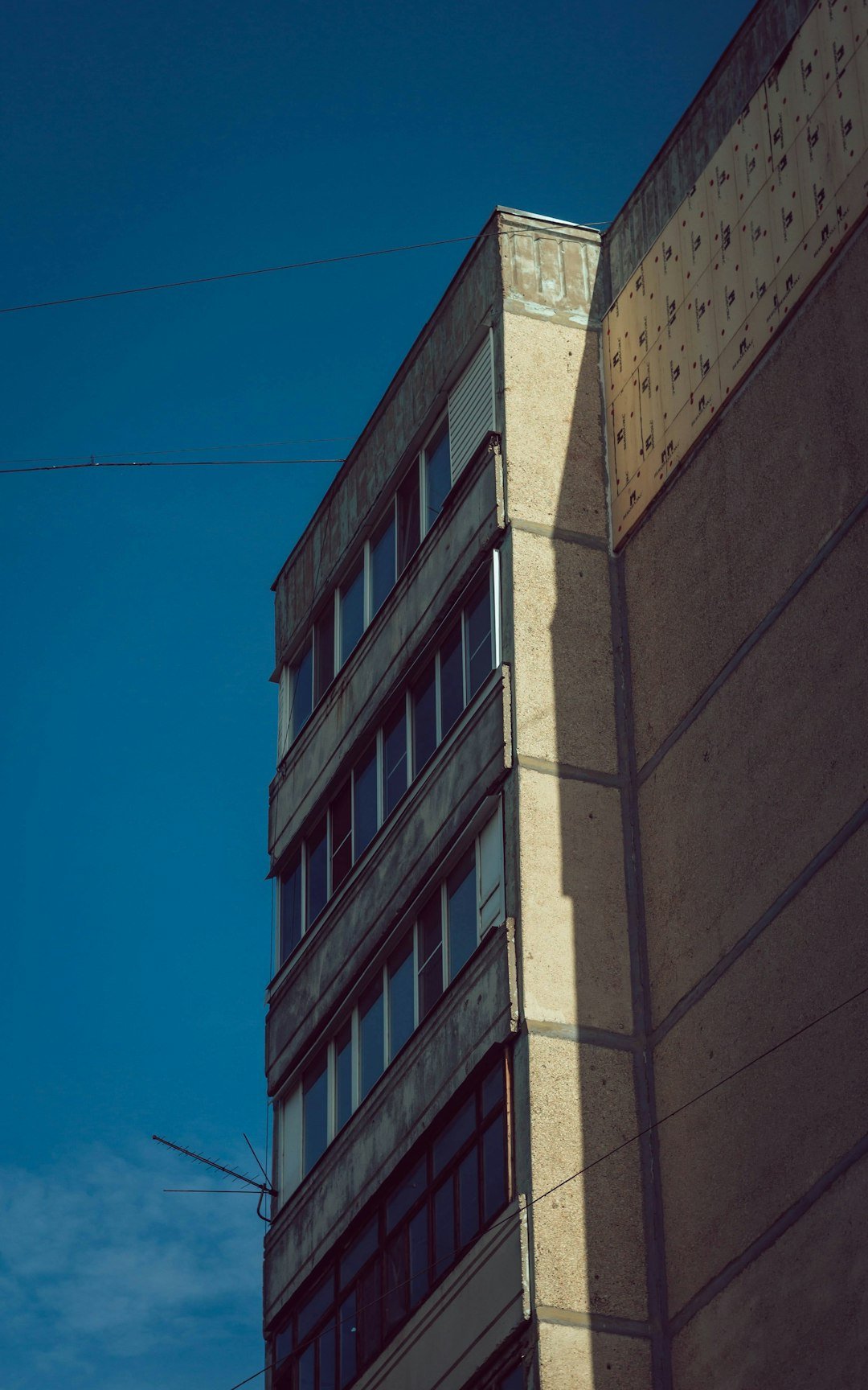 brown concrete building under blue sky during daytime