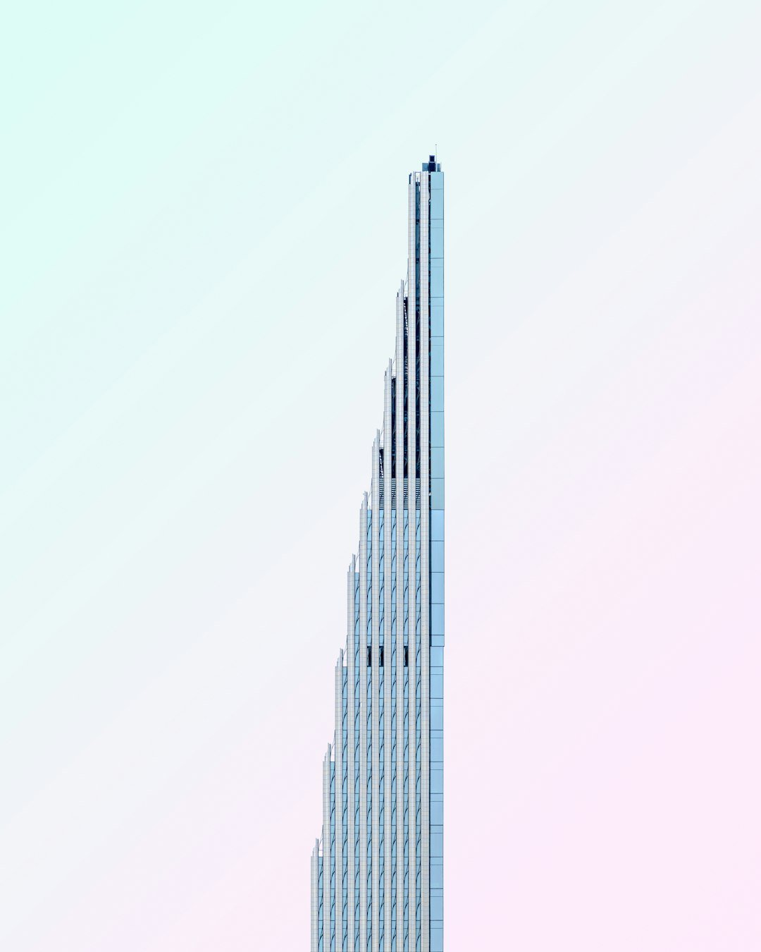 a tall building with a bird on top