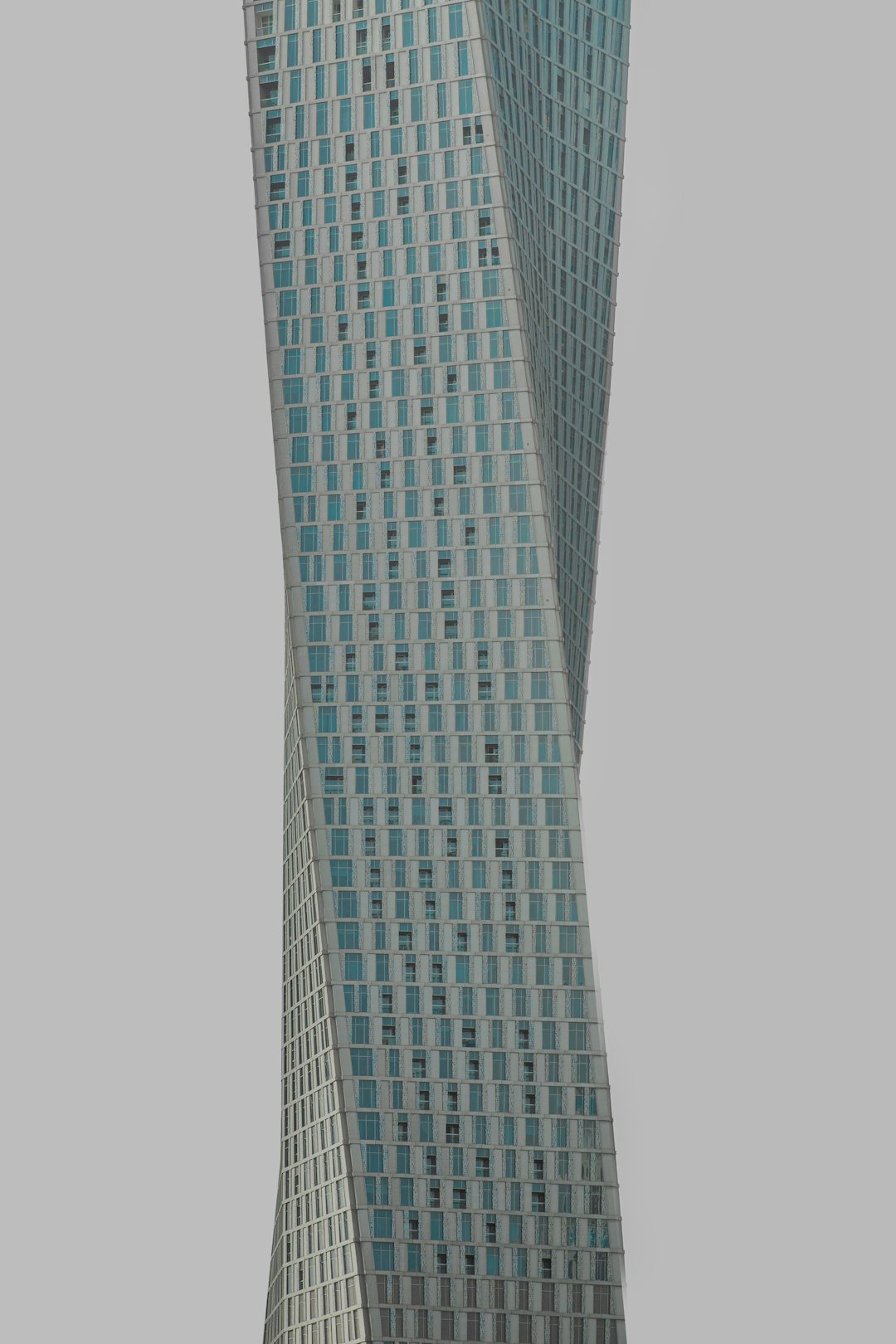 a very tall building with a clock on it's side