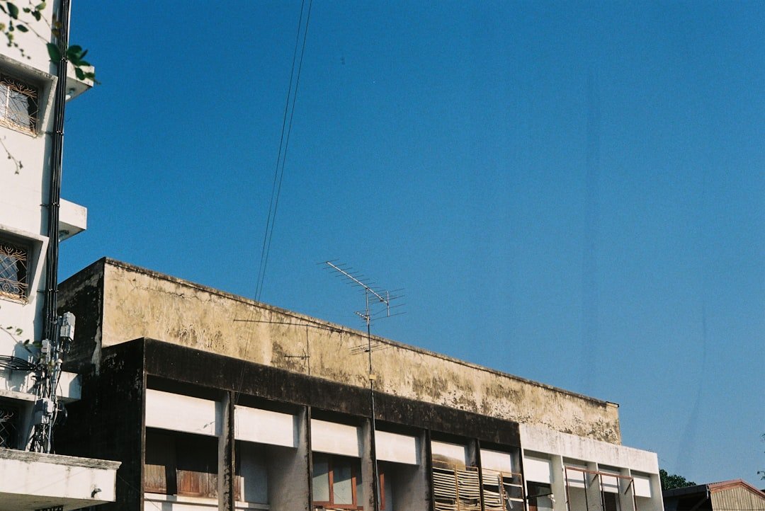 white and brown concrete building under blue sky during daytime