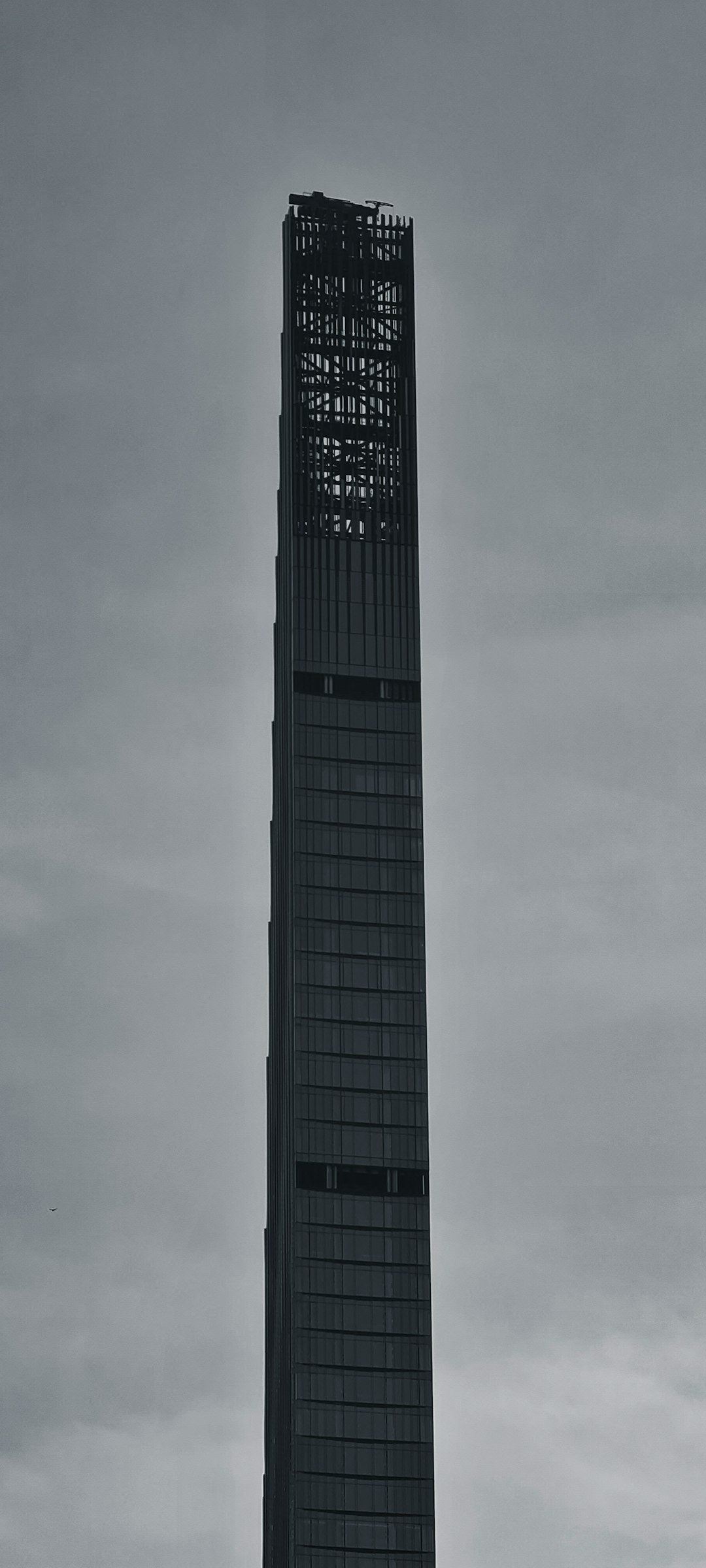 a very tall building with a clock on it's side