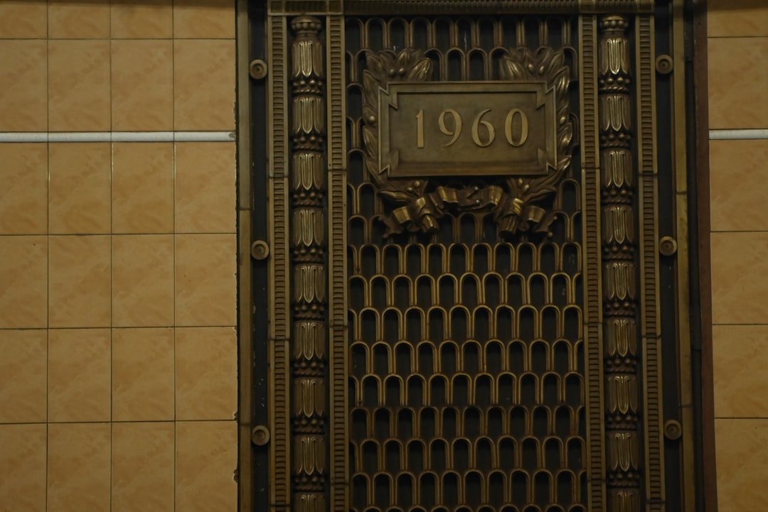 a close up of a metal door with a sign on it