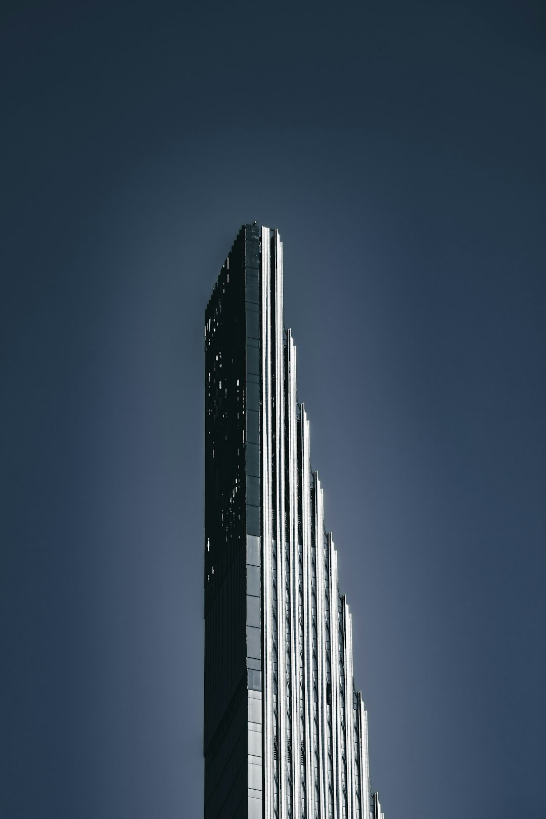 a very tall building with a clock on it's side