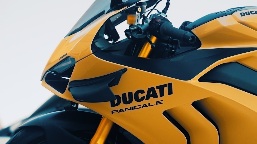 a close up of a yellow and black motorcycle