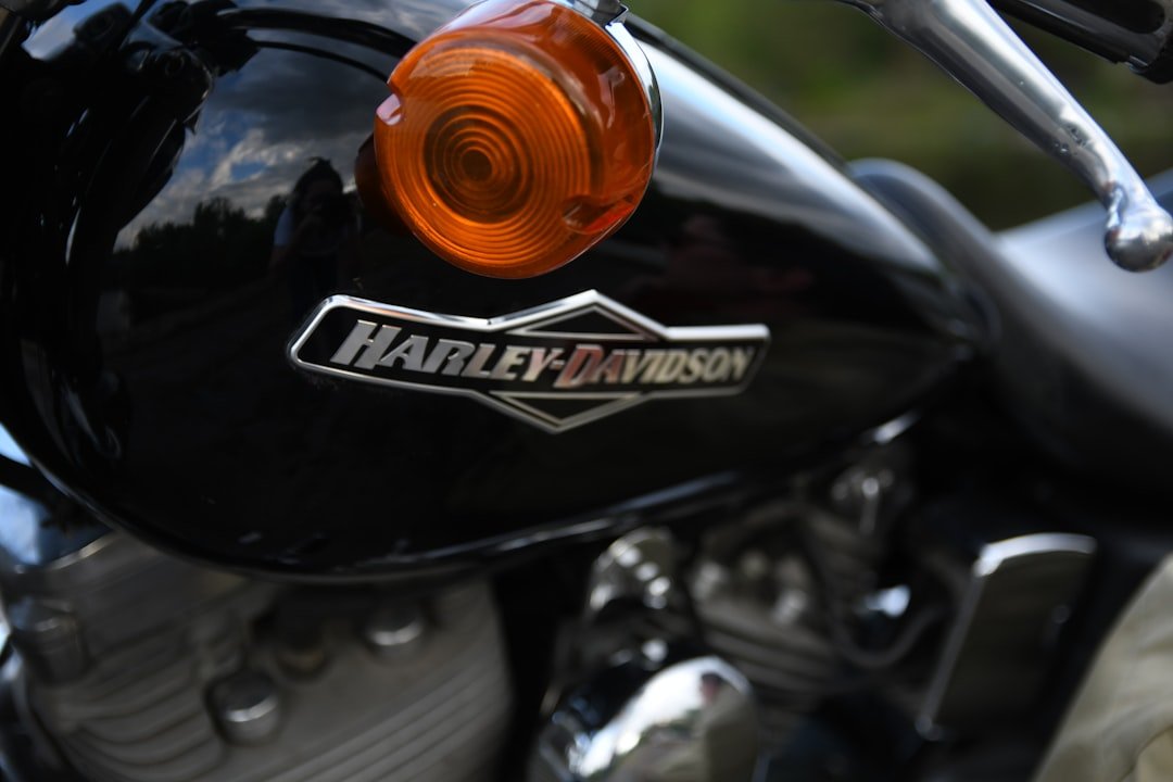 black and orange harley davidson motorcycle