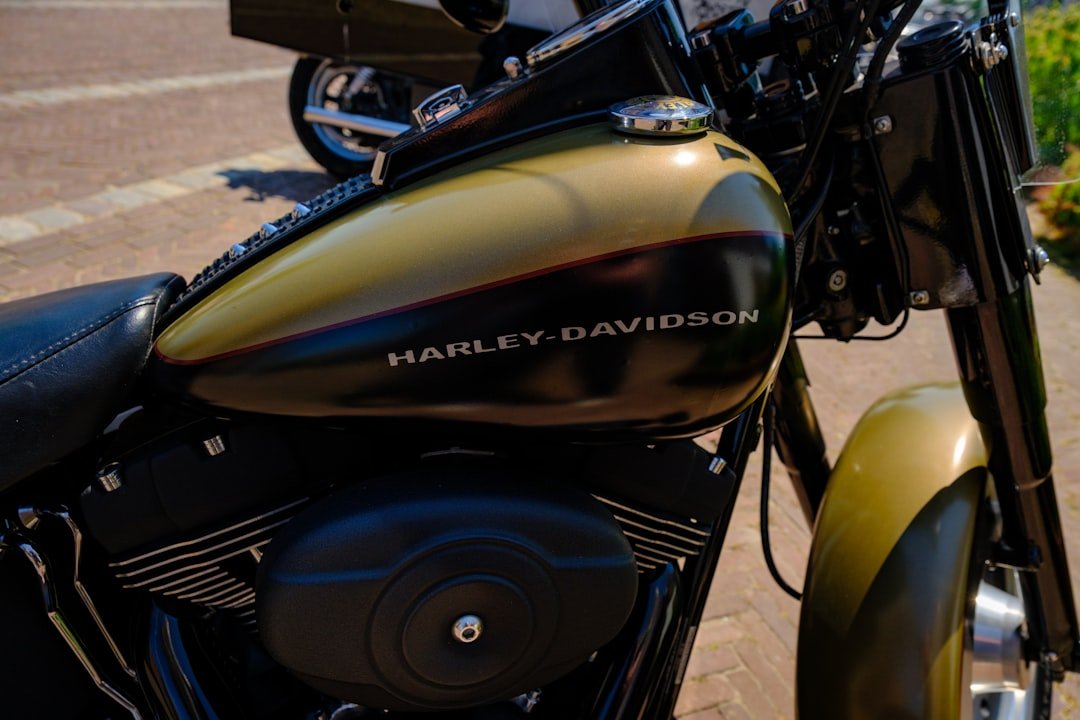a close up of a motorcycle parked on a sidewalk