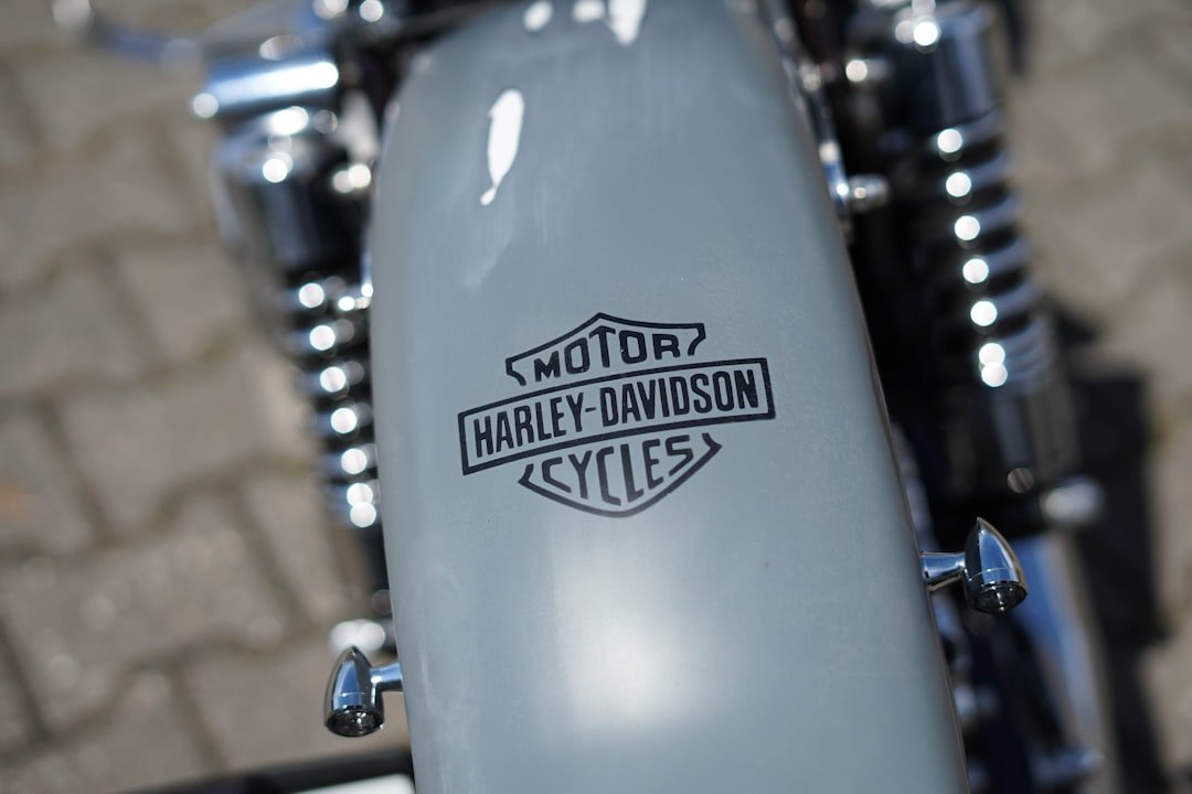 a close up of a motorcycle with a logo on it