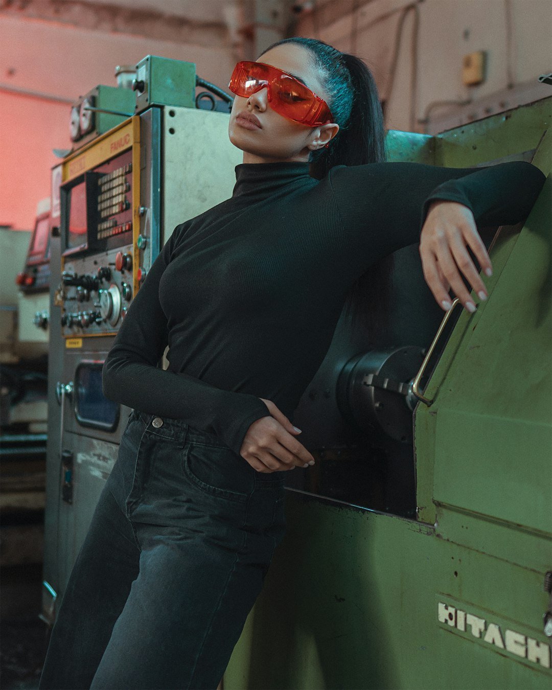 a woman in a black shirt and red glasses