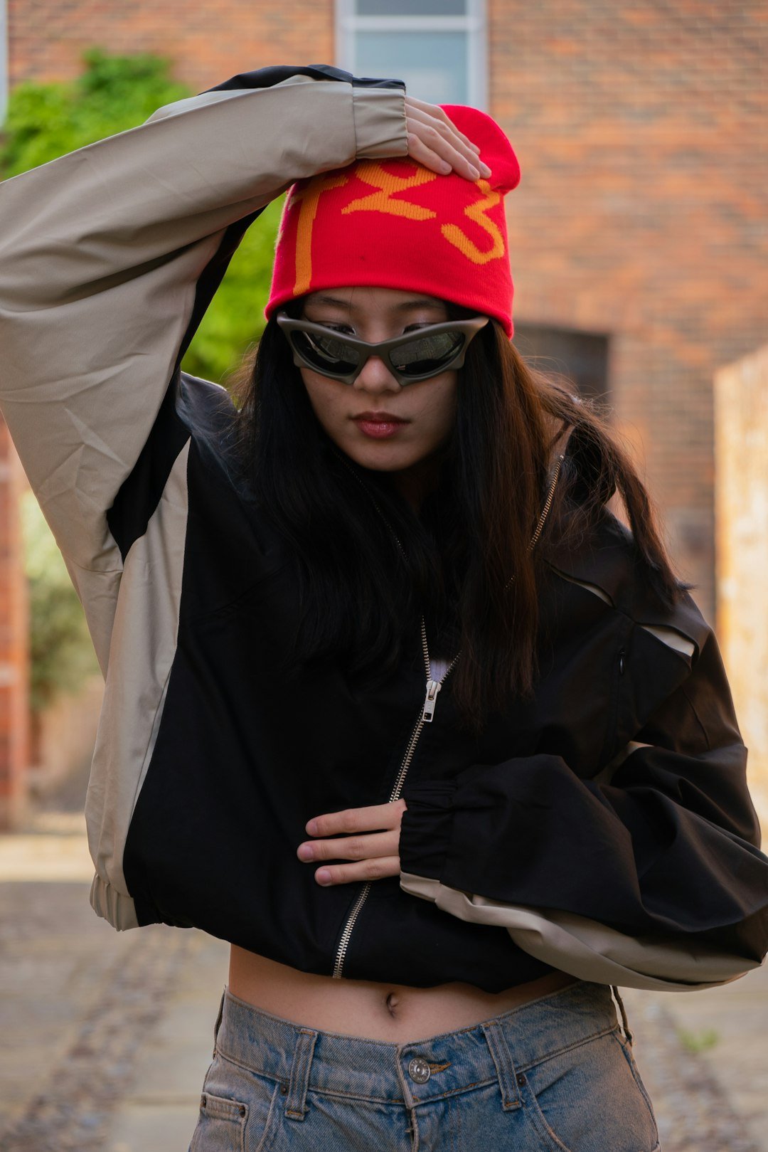 a woman wearing a red hat and sunglasses