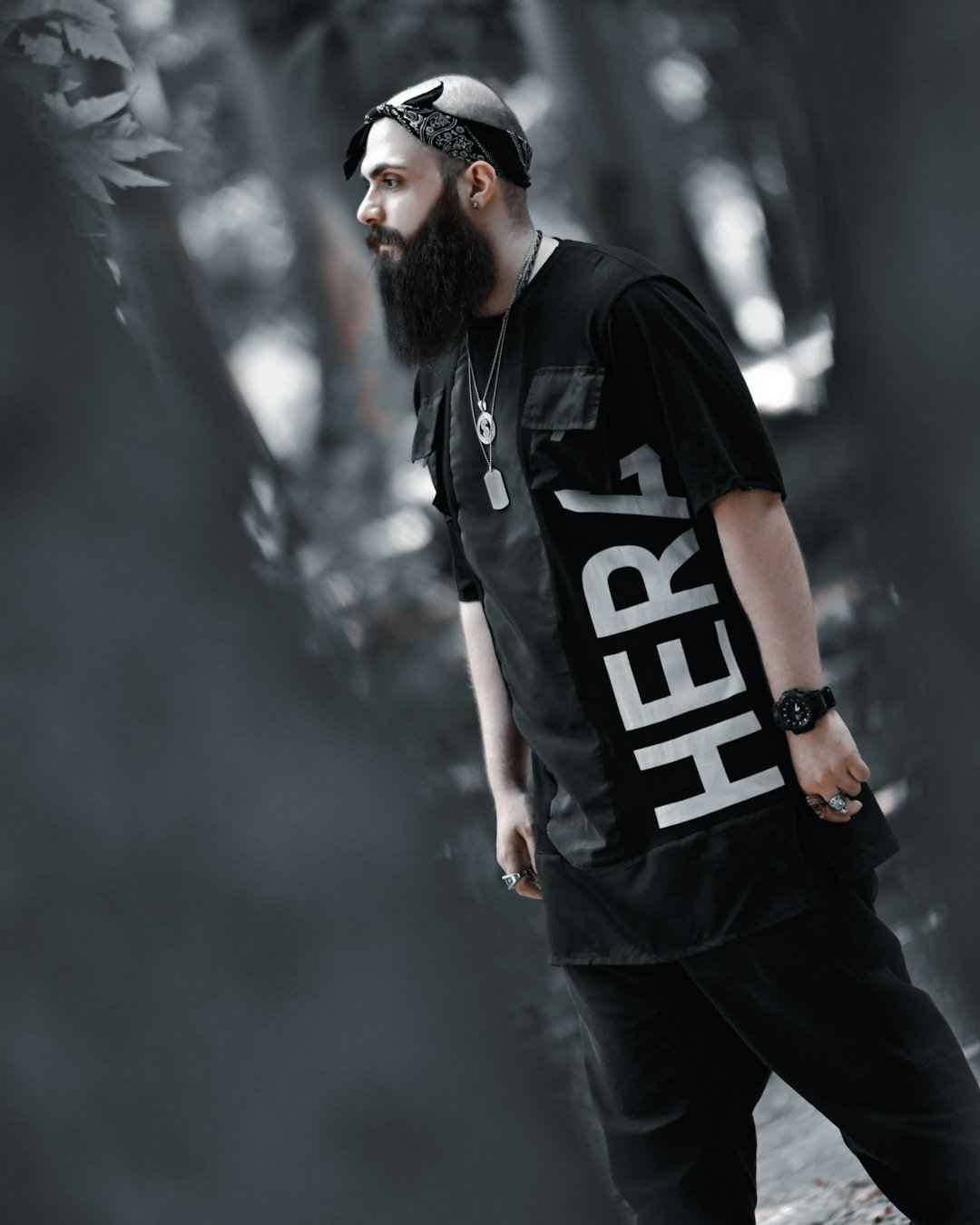 a man with a beard wearing a black shirt