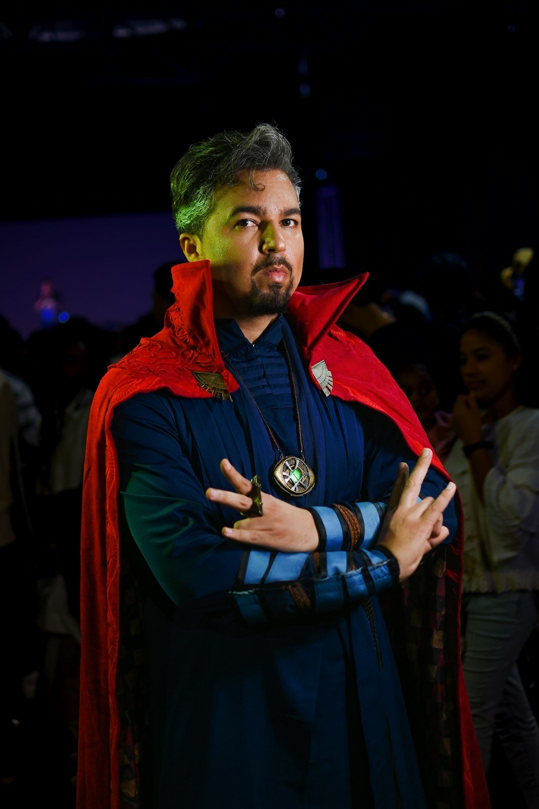 a man dressed in a blue and red costume