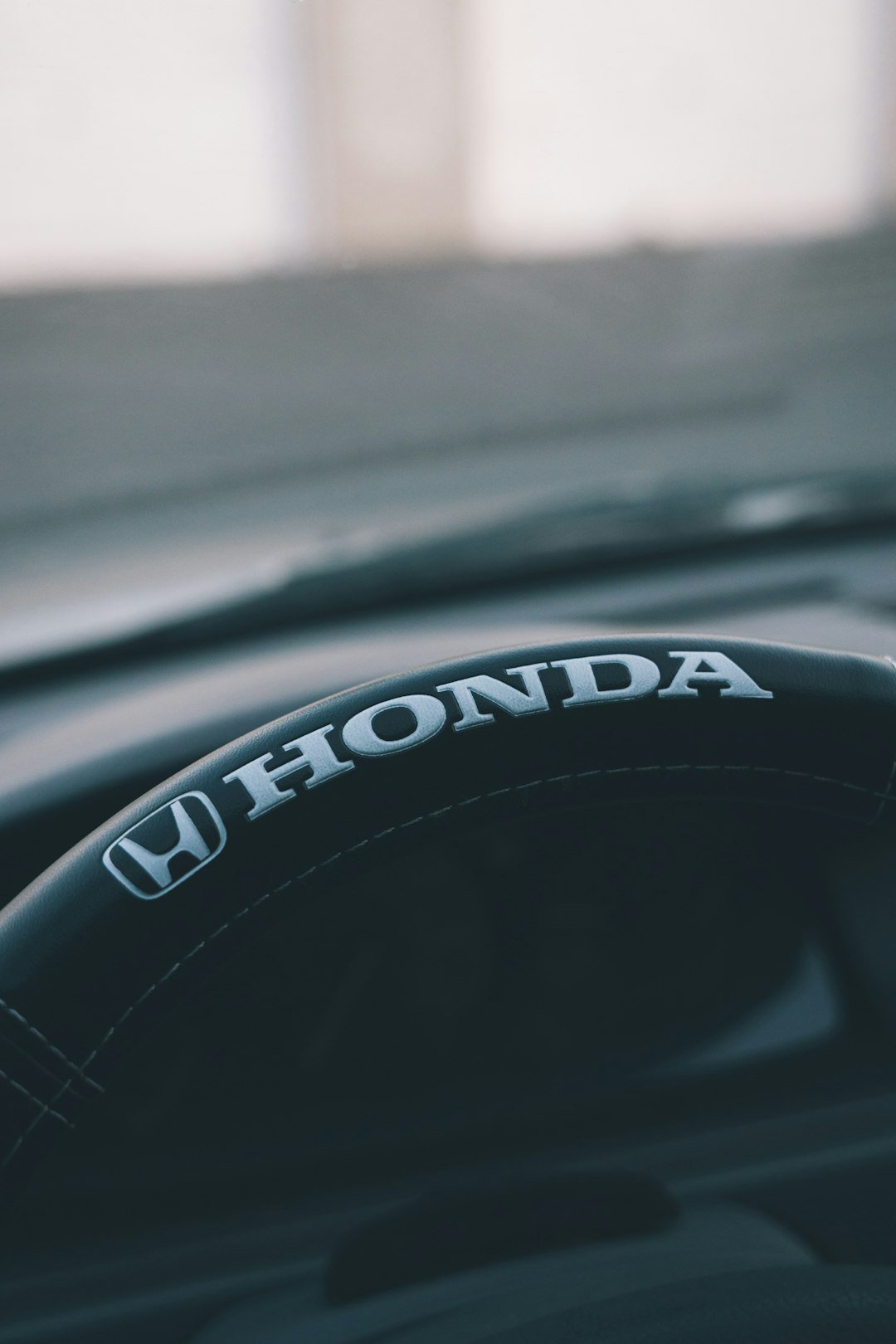 a close up of a steering wheel on a car