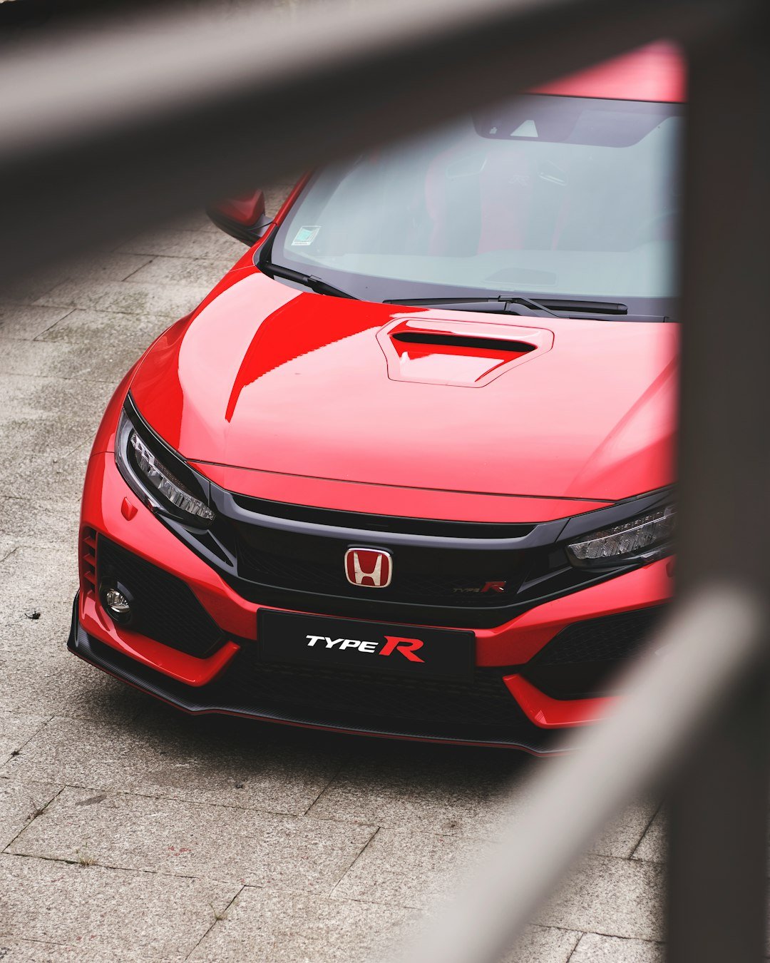 red Honda vehicle