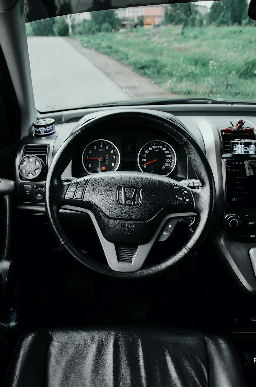Dashboard and steering wheel of a honda.