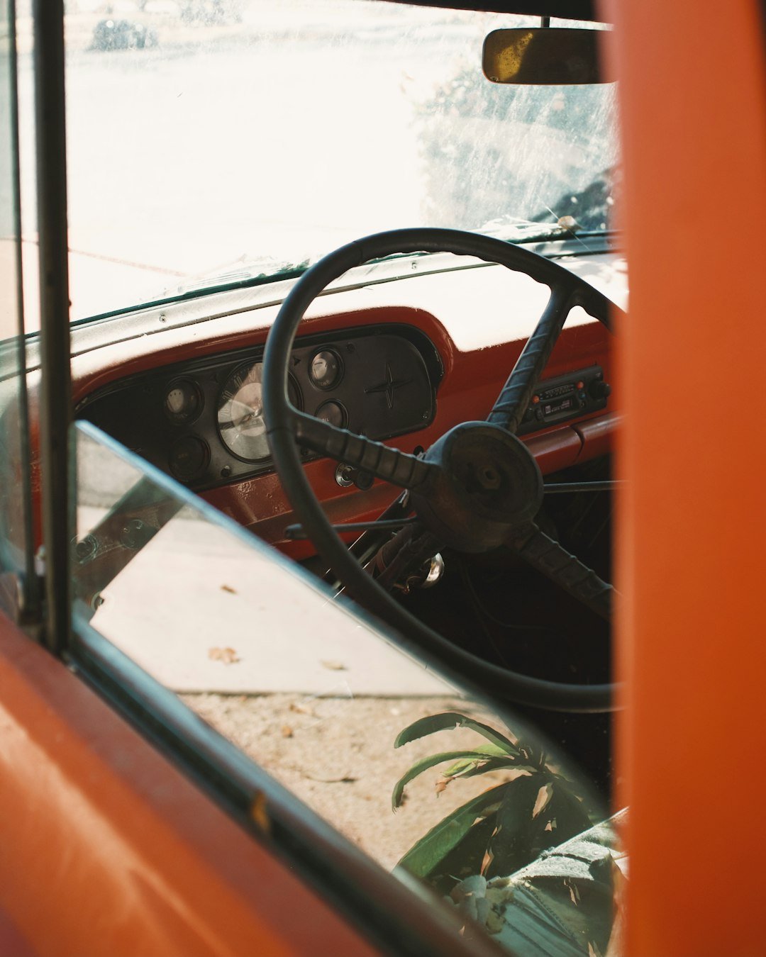 black steering wheel on orange car
