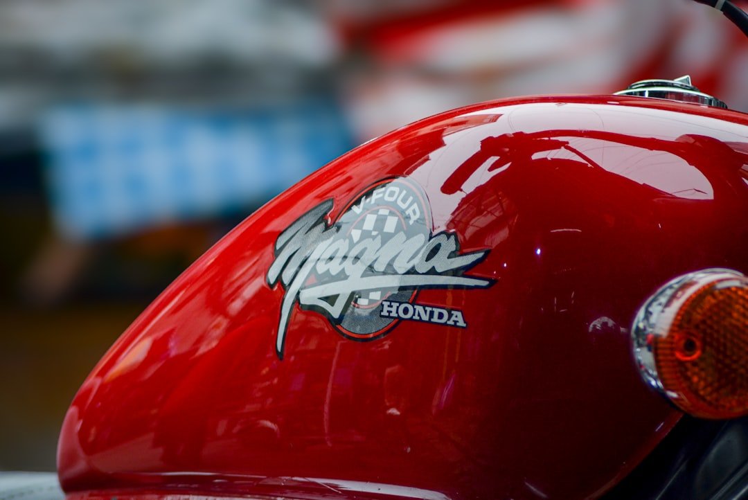 A close up of a red motorcycle helmet