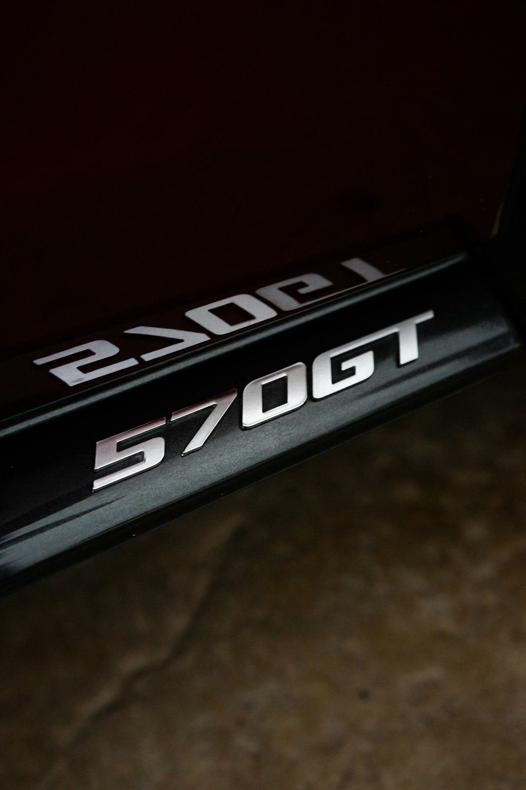 a close up of a black and white logo on a bike