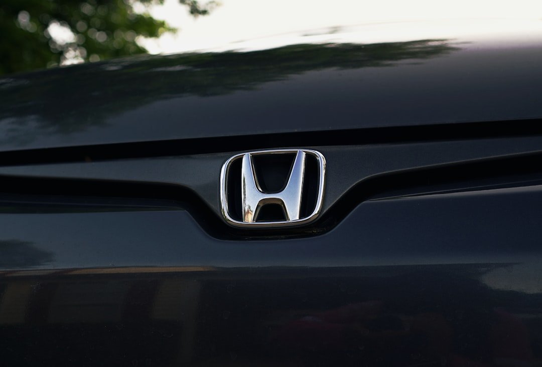 A honda emblem is displayed on a car.