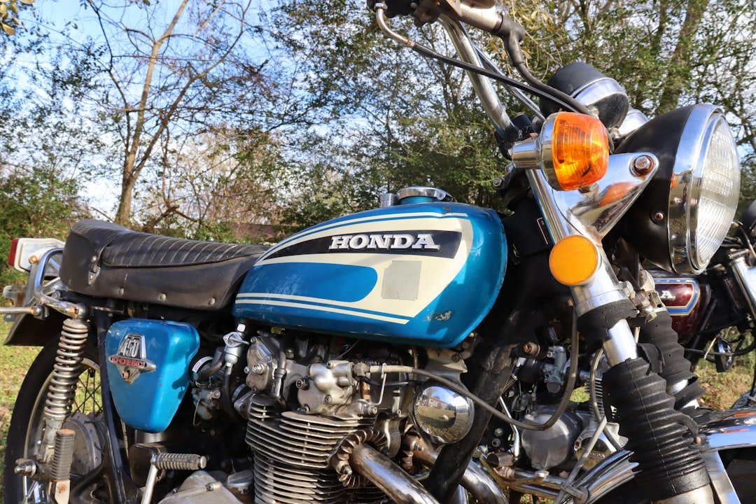 a motorcycle parked in front of trees