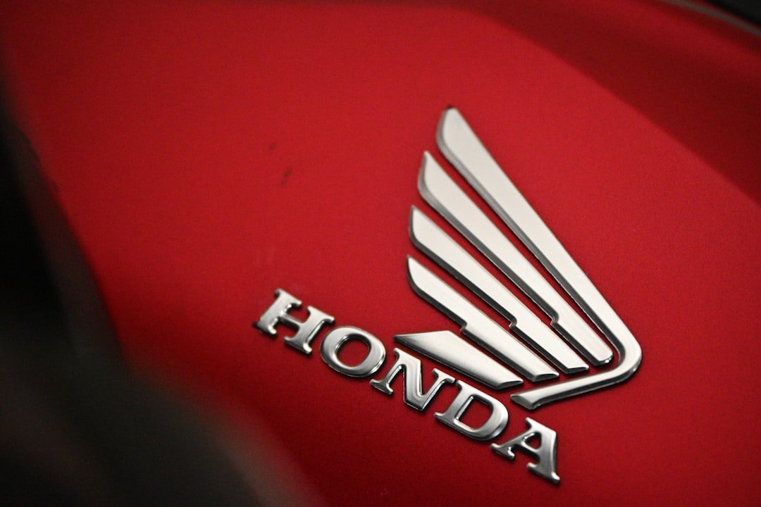 A close up of the honda logo on a motorcycle