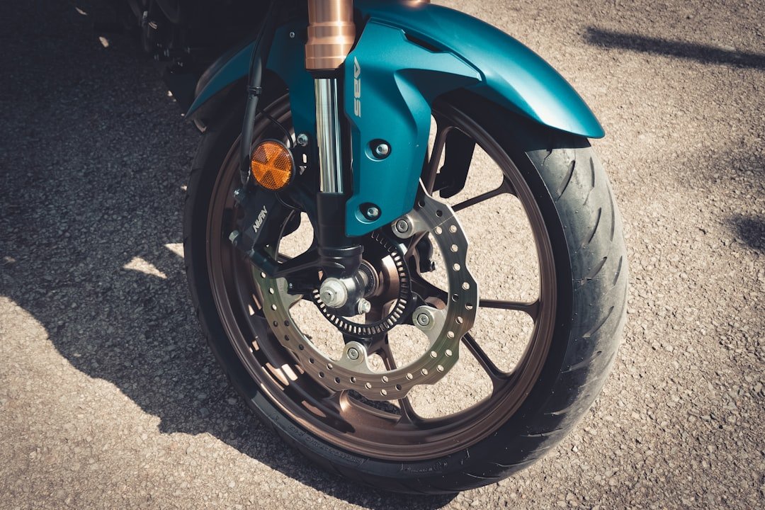 a close up of a motorcycle wheel on the ground