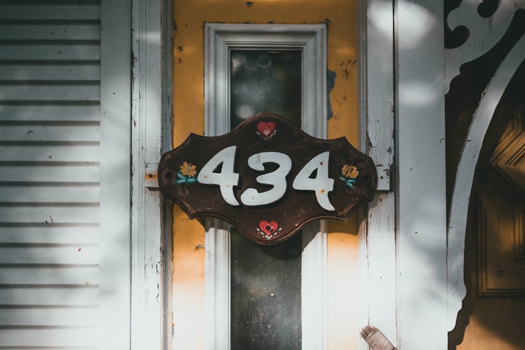 a house number sign on the front door of a house