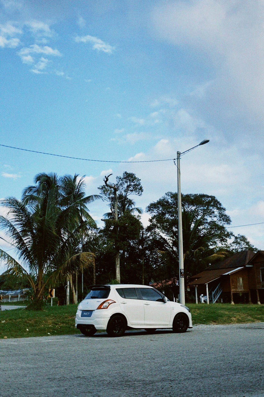 a white car parked on the side of the road
