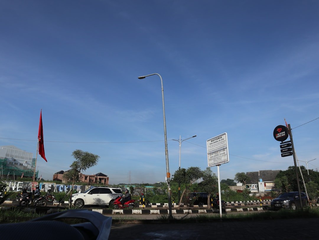 a street with cars parked on the side of the road