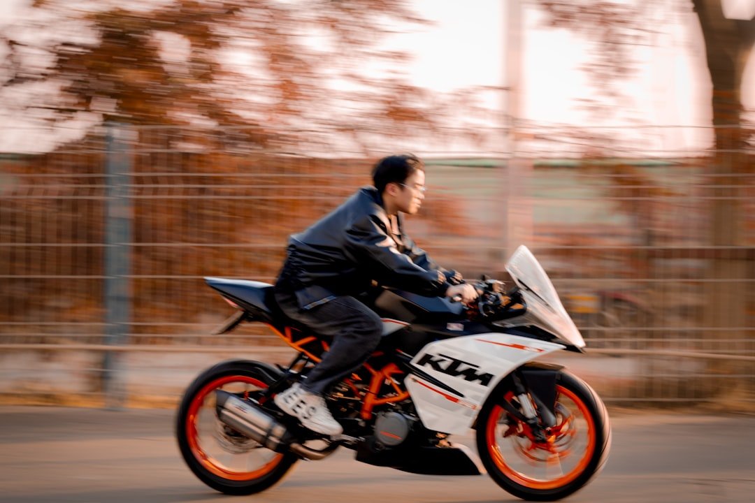 Man rides a ktm motorcycle.