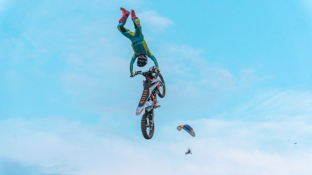 A man flying through the air while riding a bike