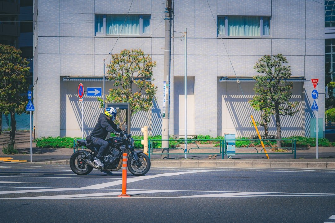a person riding a motorcycle on a city street