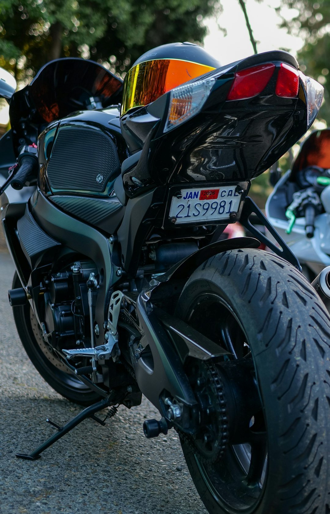 A black motorcycle with a helmet.