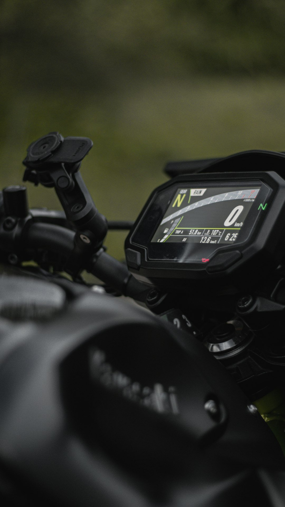 a close up of a motorcycle with a speedometer