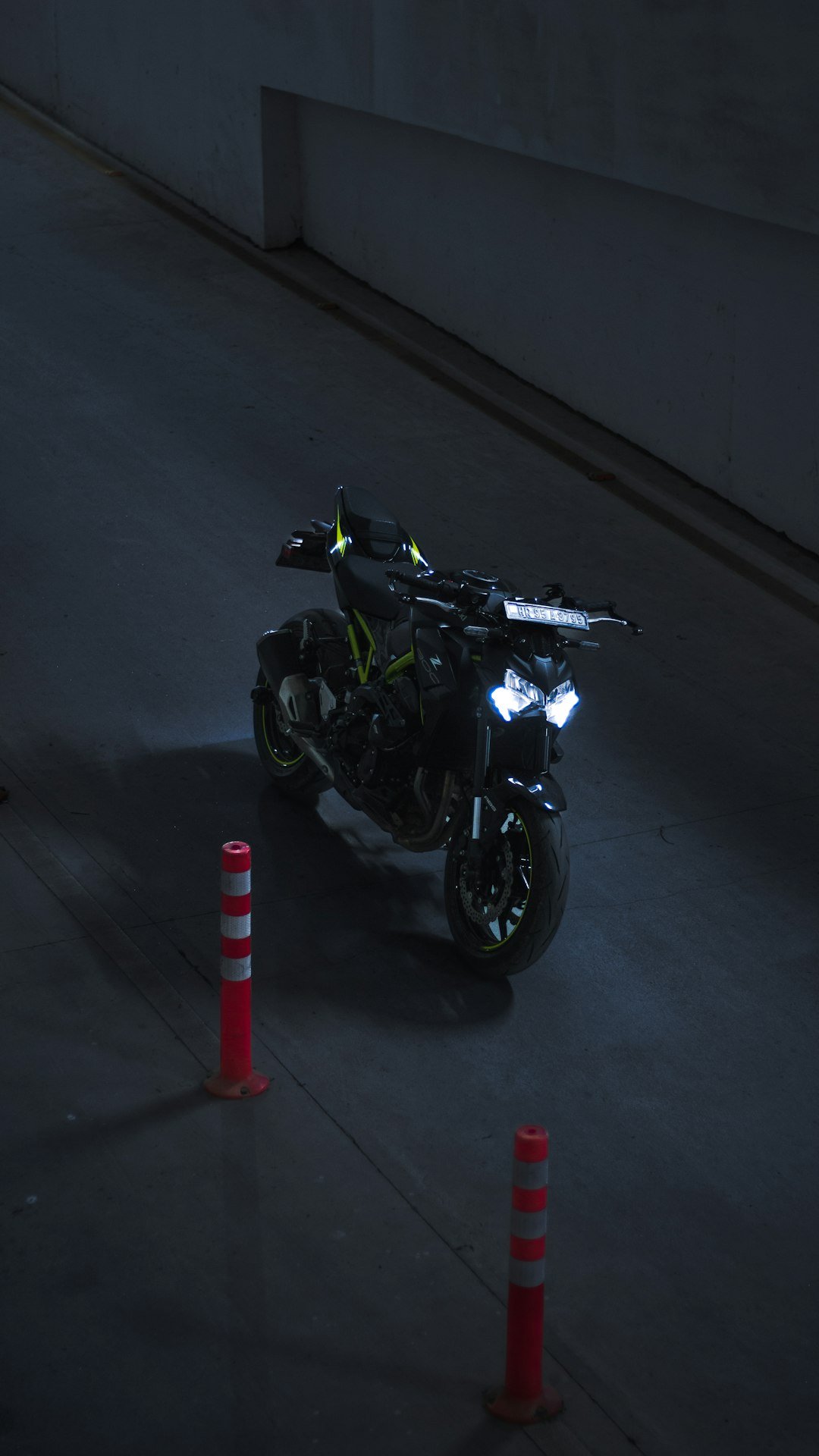 a motorcycle parked in a parking lot at night