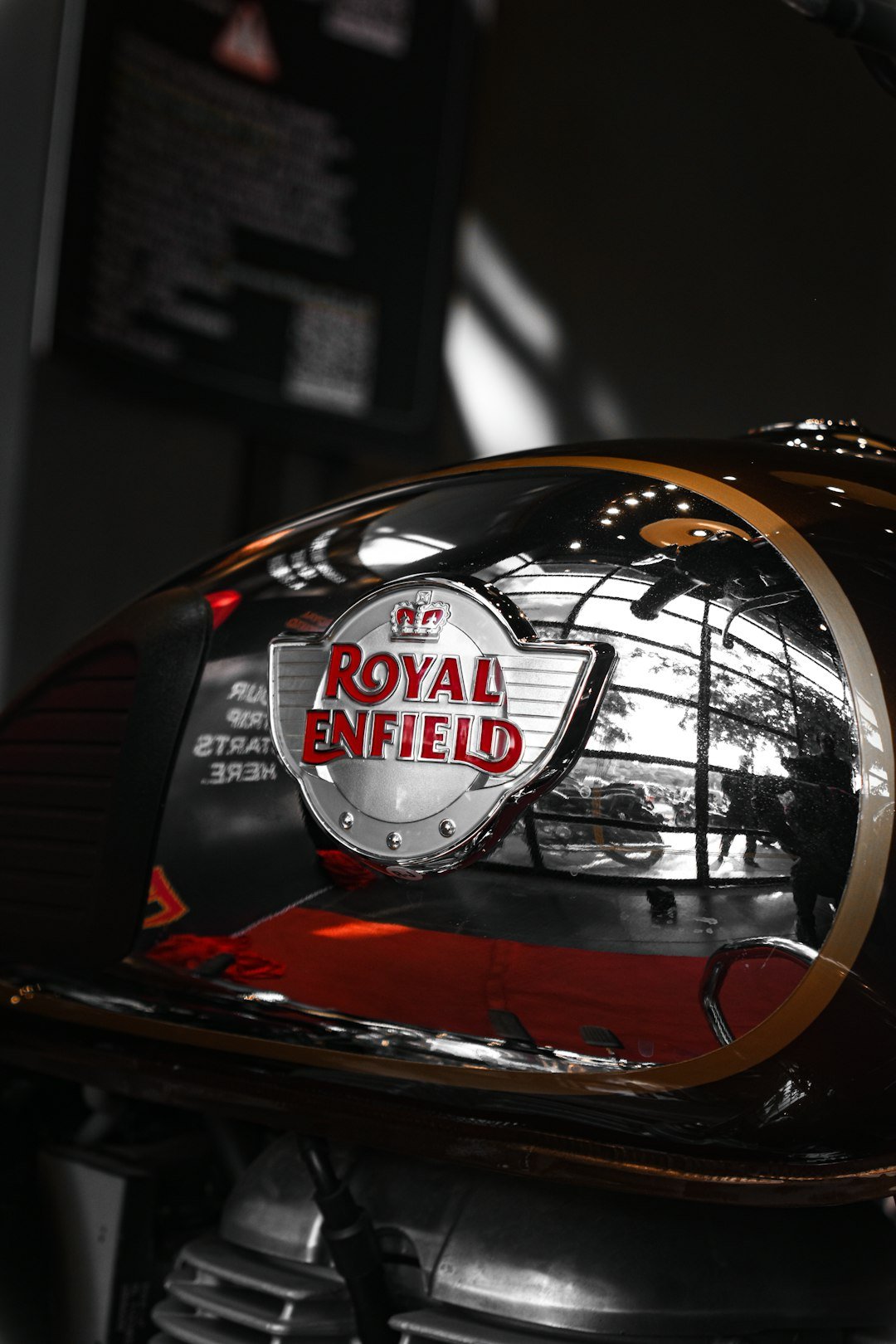 a close up of the royal enfield logo on a motorcycle