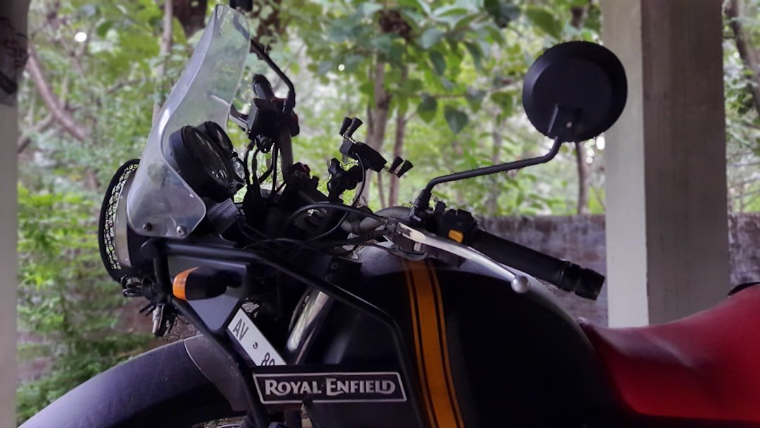 a close up of a motorcycle with trees in the background