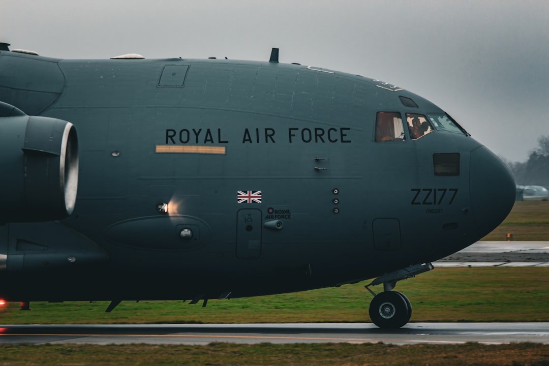 a royal air force jet sitting on top of an airport runway