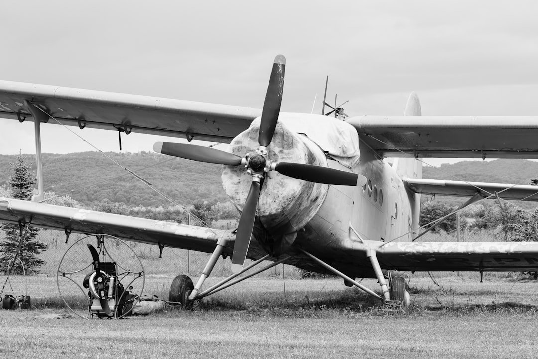 a black and white photo of an old airplane