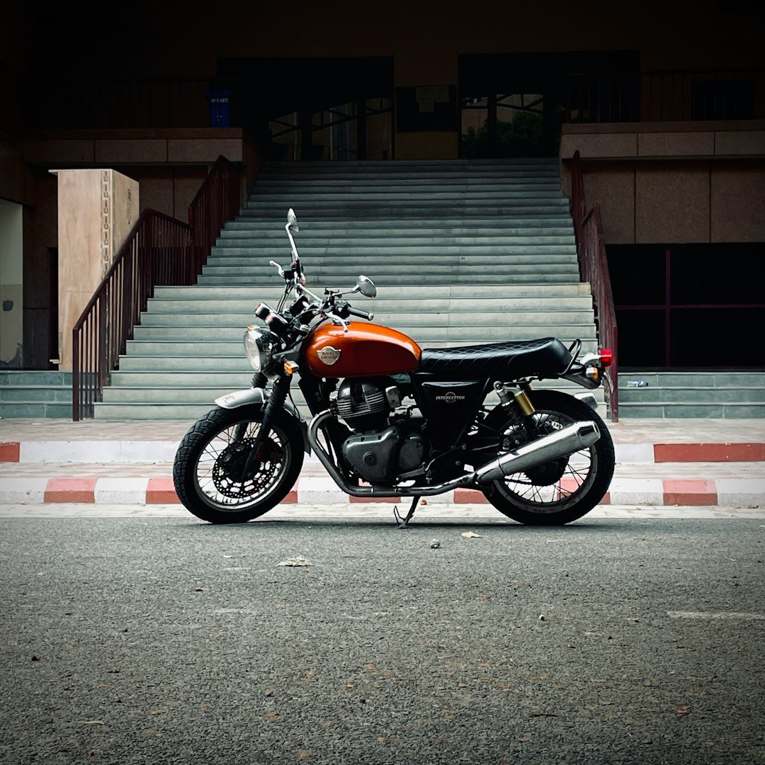 A motorcycle parked in front of a set of stairs