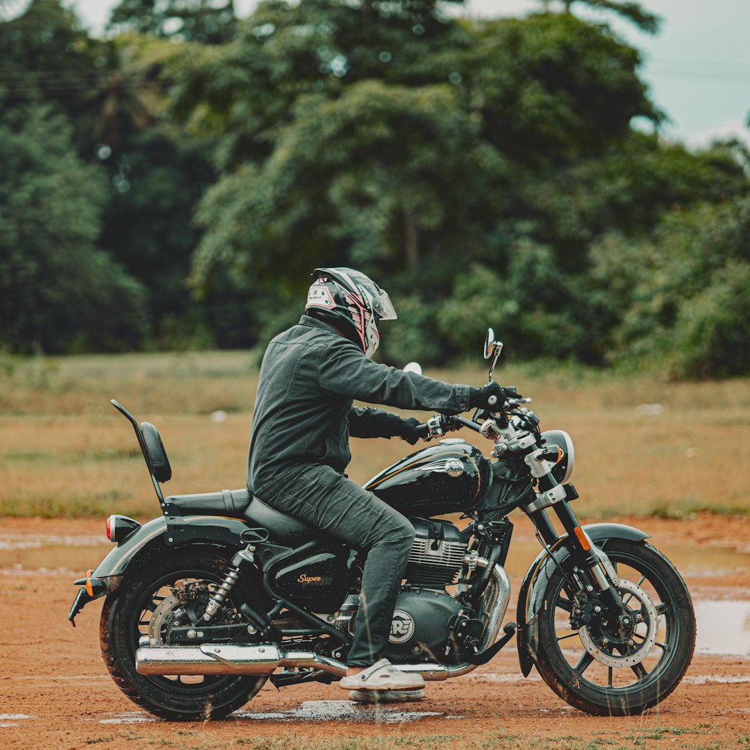 A person riding a motorcycle on a dirt road